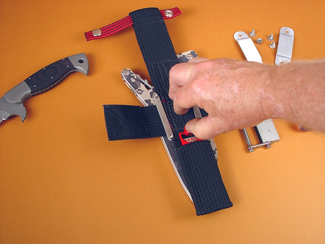 Pulling the DMT Mini-Sharp diamond sharpener from the dedicated pouch at the back of the sheath belt loop extender