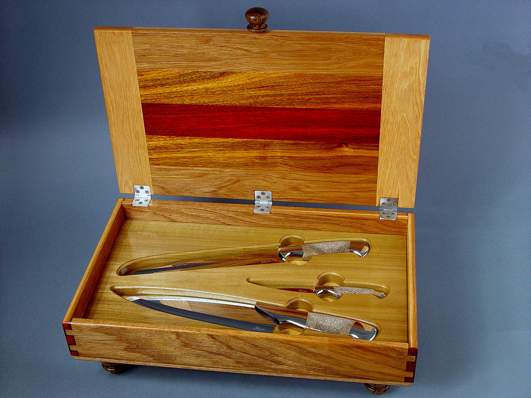 "Chef's Set" obverse side view in CPM154CM stainless steel blades, 304 stainless steel bolsters, Petrified Palm Wood gemstone handles, case of Pecan, Arririba, Padauk, Bloodwood, Bocote, Poplar, stainless steel