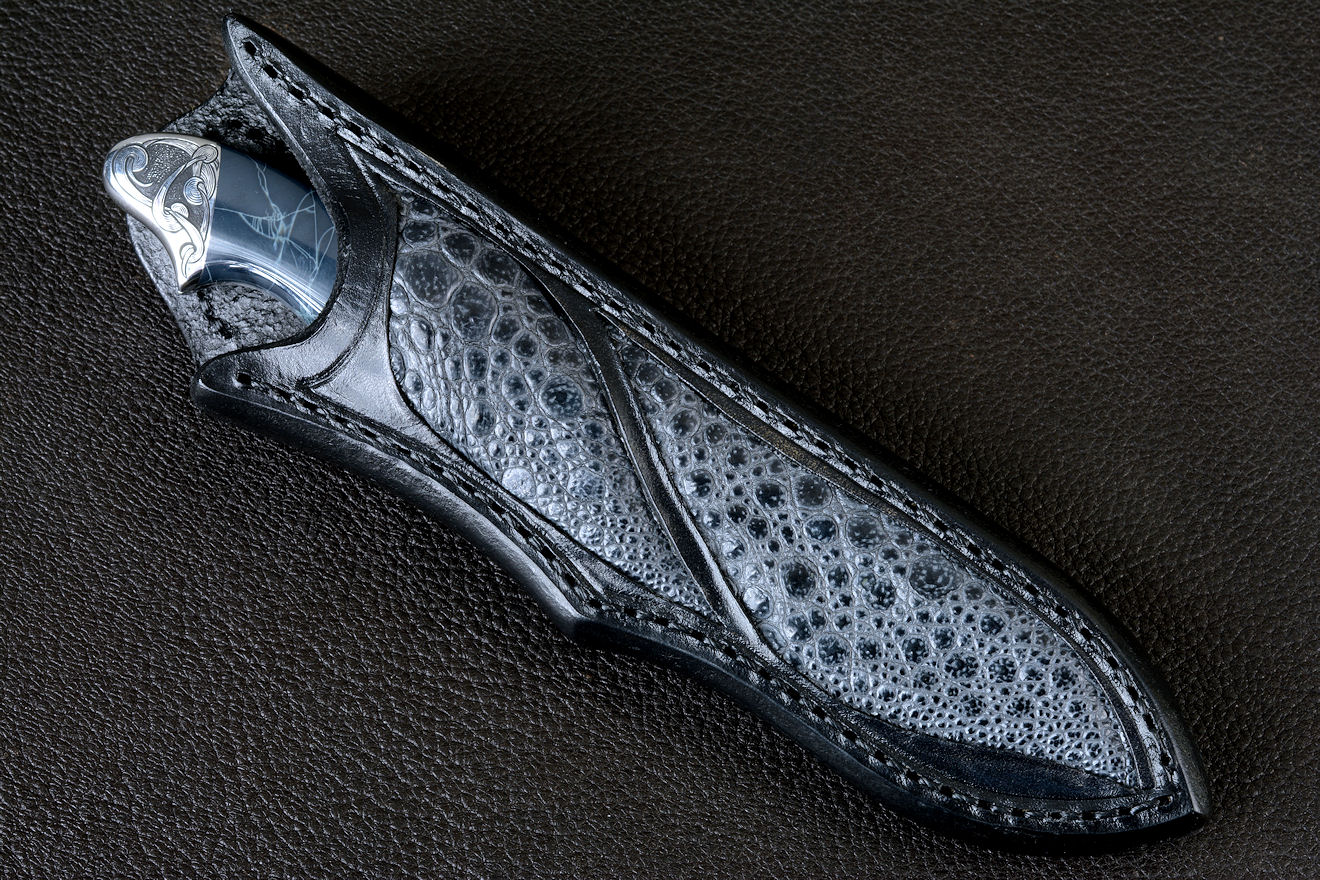 "Regulus" obverse side view in 440C high chromium stainless steel blade, hand-engraved 304 stainless steel bolsters, Spiderweb Obsidian gemstone  handle, Frog skin inlaid in hand-carved leather sheath