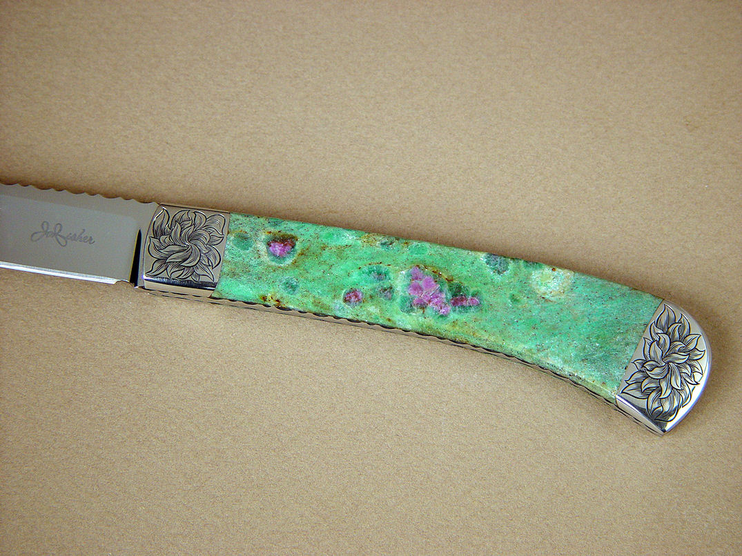 "Shaula" obverse side view in ATS-34 high molybenum stainless steel blade, hand-engraved 304 stainless steel bolsters, Ruby in Fuchsite gemstone handle, lizard skin inlaid in hand-carved leather shoulder