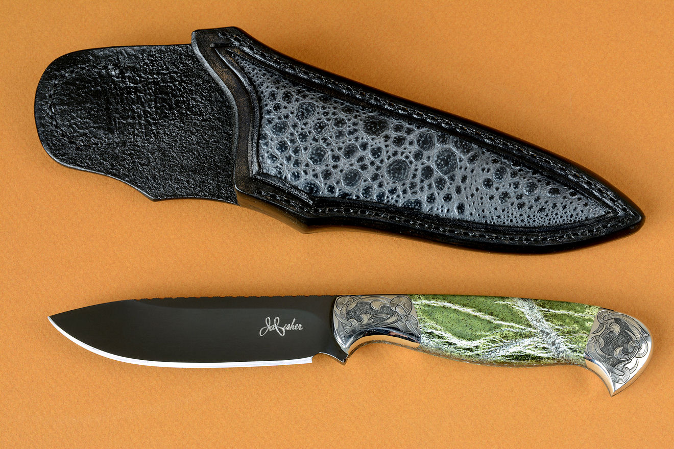 "Vulpecula" obverse side view in hot-blued O1 high carbon tungsten vanadium tool steel alloy, hand-engraved 304 stainless steel bolsters, Silver Leaf Serpentine gemstone handle, Frog skin inlaid in hand-carved leather sheath