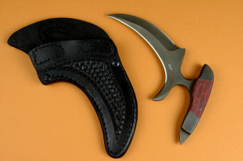 "Chela" karambit knife, obverse side view in T4 cryogenically treated 440C high chromium martensitic stainless steel blade, 304 stainless steel bolsters, red and black tortoiseshell G10 composite handle, leather sheath with stainless steel and nylon