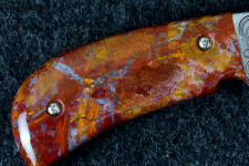 Roostertail agate is durable enough to support machine screws for a folding knife handle Roostertail agate is durable enough to support machine screws for a folding knife handle