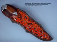 "Tribal" in hand-engraved 440C high chromium stainless steel blade, hand-engraved 304 stainless steel bolsters, Pilbara Picasso Jasper gemstone handle, sheath of hand-carved, hand-dyed leather shoulder, stand of 304 stainless steel, American black walnut, mesquite, lauan hardwoods, engraved black lacquered brass